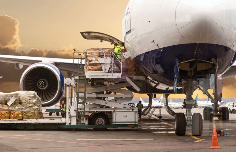 Loading cargo on the plane in airport