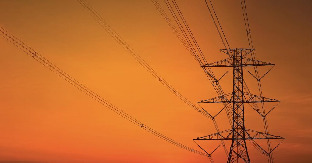 Electricity pylon against the sunset sky background