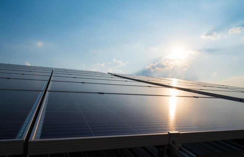 Solar panels on a roof with blue sky
